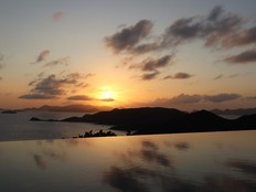 The sun sets over the private infinity pool at Falcon's Nest Villa, one of four villas on the Peter Island Resort.