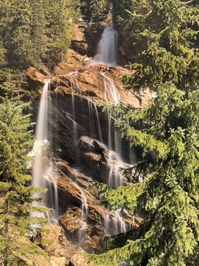 An image of Pyramid Falls as seen from the Rocky Mountaineer train in Canada.
