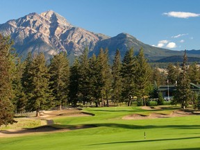 The golf course at Fairmont Jasper Park Lodge is surrounded by stunning mountain scenery.