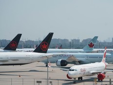 Air Canada airplanes stand on the tarmac at Pearson International Airport in Toronto on August 16, 2025.