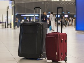 Two suitcases at an airport