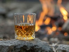 Glass of whisky by the fire