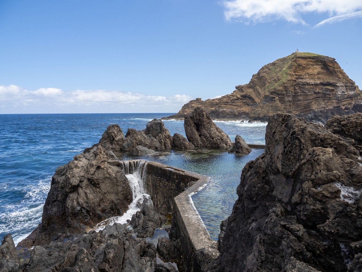 Concrete walls enclose volcanic rock to form the oceanfront swimming pools in Porto Moniz.