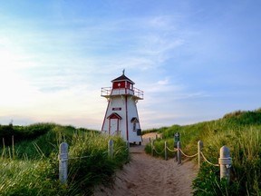 A lighthouse is seen at Covehead Beach on Prince Edward Island, also named one of the best islands in Canada by Travel + Leisure.