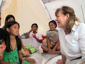 Rosemary talks to a group of children in Eastern Samar, Philippines following Typhoon Haiyan.