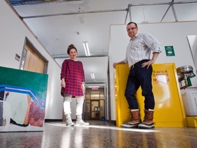Professor Andrew Wright, right, and graduate student Jessica Bell stand outside her new studio space at the University of Ottawa.(Wayne Cuddington / Ottawa Citizen)
