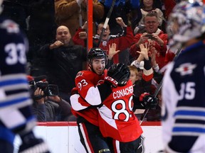 Mika Zibanejad, left, and Cory Conacher of the Ottawa Senators celebrate Zibanejad's goal against the Winnipeg Jets during first period NHL action at Canadian Tire Centre on Thursday, January 2, 2014.