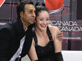 Kaetlyn Osmond is hugged by her coach as learns that she sits in first place after competing in the Senior Women's Short program as the Canadian Tire National Skate Canada 2014 Championships continued at Canadian Tire Centre on Friday, January 10, 2014.