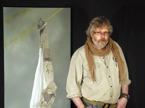 Ottawa artist Bruce Stewart with "Hung Out to Dry," a  painting he made in protest of the government's treatment of veterans.  (Photo by Julie Oliver/Ottawa Citizen)