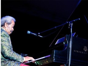 Allen Toussaint plays piano during the 2012 Ottawa Jazz Festival. New research shows that the brains of jazz musicians playing music together acted much like the brains of people having a spoken conversation.