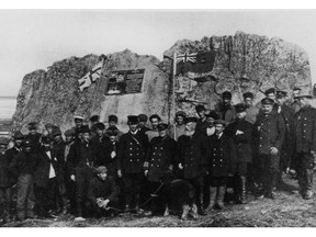 Bernier and the crew of the Arctic  posed for his sweeping proclamation at Parryís Rock on Melville Island, Dominion Day, July 1, 1909. Bernier is front row, centre, with the baby muskox. [J.E. Bernier Collection, Library and Archives Canada, accession number 1976-193, C-001198.]