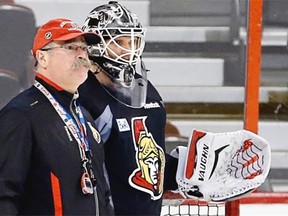 Coach MacLean chats with goalie Robin Lehner at the Ottawa Senators’ practice at Canadian Tire Centre Friday, Feb. 28, 2014.