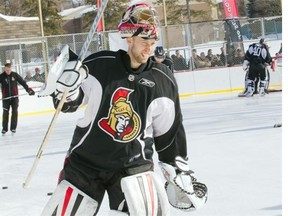 Goalie Craig Anderson squints as he steps on the ice as the Ottawa Senators practice on an outdoor rink at Jules Morin Park on York St.