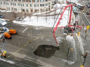A sinkhole opened up near the University of Ottawa at Laurier Avenue and Waller Street in Ottawa on Friday.