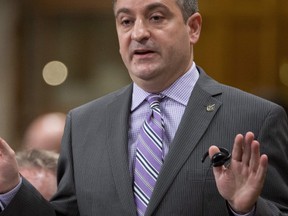 Parliamentary Secretary to the Prime Minister Paul Calandra responds to a question during Question Period in the House of Commons, Monday November 18, 2013 in Ottawa. THE CANADIAN PRESS/Adrian Wyld