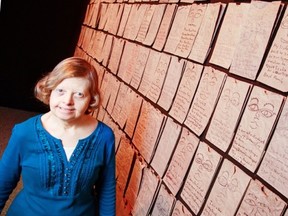 Irene Beck with her installation of lunch bags in the New Ottawa Artist Showcase, at SAW Gallery. (Photo by Chris Mikula, Ottawa Citizen)