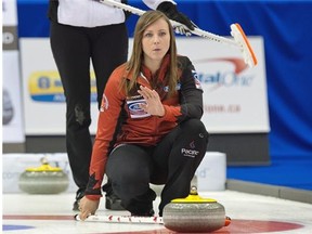 Andrew Vaughan/Canadian Press
 Skip Rachel Homan directs Canadian sweepers during Friday’s playoff game against Switzerland in the women’s world curling championship at Saint John, N.B.