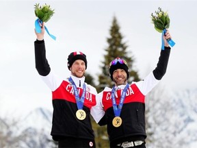 Canada’s Brian McKeever, right and guide Erik Carleton win gold in the men’s 10 km Visually Impaired cross-country at the 2014 Winter Paralympics in Sochi, Russia on March 16, 2014.