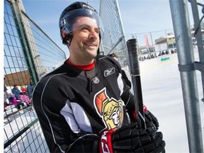 Chris Phillips is all smiles as he steps on the ice as the Ottawa Senators practice on an outdoor rink at Jules Morin Park on York St.