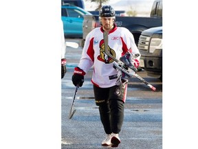 Cory Conacher carries his skates into the arena as the Ottawa Senators practice at the Bell Sensplex following the Olympic break.