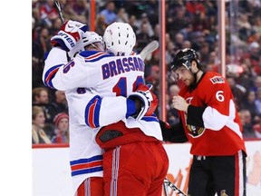 Derick Brassard of the New York Rangers celebrates his goal with Kevin Klein as Bobby Ryan skates on dejected during second period of NHL action at the Canadian Tire Centre in Ottawa, March 18 2014. (Jean Levac/Ottawa Citizen)