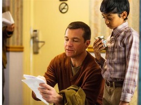 Director and actor Jason Bateman (C) reviews a scene with costar Rohan Chand on the set of the comedy “Bad Words,” a Focus Features release.