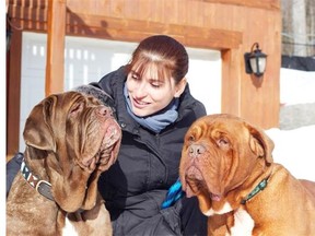 France Turcotte with Sydney, left, and Austin, who is terminally ill, right. Turcotte’s sanctuary, a federally registered charity, has saved 86 dogs since 2009, including successfully turning around the lives of 14 dogs recovered from Canada’s largest puppy mill in 2010.