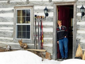 Artist Karen McBride’s studio is in an old log cabin that she corralled family and friends to help disassemble, transport and reassemble at her Dunrobin horse farm.