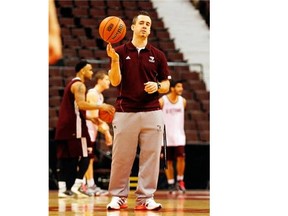 James Derouin, Ottawa Gee-Gees basketball coach, directs his players during practice at Scotiabank Place in Ottawa, March 07, 2013.