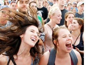 Jimmy Eat World fans Erin Virgint, left, and Kathleen Cauley  go crazy for their band at opening night of RBC Bluesfest 2013.