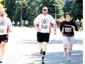 Jody Mitic, shown here at the Canada Army Run in 2009, lost both legs when he stepped on a landmine in Afghanistan in 2007. He is the Honorary Race Starter for 2014 EY Run for Reach on April 13.