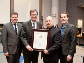 John Therien, third from left, receives his Mayor’s City Builder Award from (from left) Coun. Steve Desroches, Mayor Jim Watson and Coun. Mathieu Fleury.