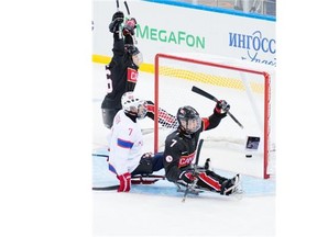 Marc Dorion of Bourget scores Canada’s final goal in a 4-0 victory against Norway during Sochi Winter Paralympic Games sledge hockey action on Sunday. (Matthew Murnaghan/Canadian Paralympic Committee)