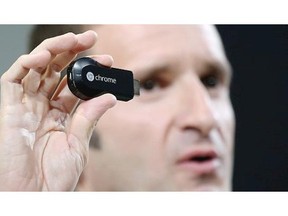 Mario Queiroz, Vice President of Product Management at Google, holds up a new Google Chromecast SDK as he speaks during a special event at Dogpatch Studios on July 24, 2013 in San Francisco, California.