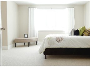 The master bedroom features his and hers walk-in closets and a generous ensuite.