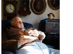 Mayor Robert Jason Hardy of Bolivar (pop. 1,025) reclines at his antique store on the main street of the village. West Virginia has finished last for the fifth consecutive year in the Gallup-Healthways Well-Being Index.