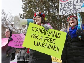 Members of the Ottawa Ukrainian community and their supporters gather outside the Russian Embassy to protest recent actions by the Russians in Crimea and other parts of Ukraine.