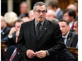 File Photo: Treasury Board President Tony Clement responds to a question during question period in the House of Commons Thursday October 24, 2013 in Ottawa.