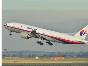 This photo provided by Laurent Errera taken Dec. 26, 2011, shows the Malaysia Airlines Boeing 777-200ER that disappeared from air traffic control screens Saturday, taking off from Roissy-Charles de Gaulle Airport in France. The Malaysia Airlines Boeing 777-200 carrying 239 people lost contact with air traffic control early Saturday morning, March 8, 2014 on a flight from Kuala Lumpur to Beijing, and international aviation authorities still hadn't located the jetliner several hours later. (AP Photo/Laurent Errera)