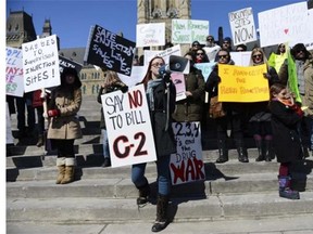 One of the organizers for the Campaign for Safer Consumption Sites, Jordon MacLean, talks about the reason behind the rally while sharing his personal experience with the danger of addiction during The Campaign for Safer Consumption Sites in Ottawa held at Parliament Hill on Sunday, March 23, 2014.