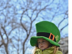 A child wearing a green hat with a shamrock takes part in a parade celebrating St Patrick's Day, in Bucharest, Romania, Sunday, March 16, 2014.