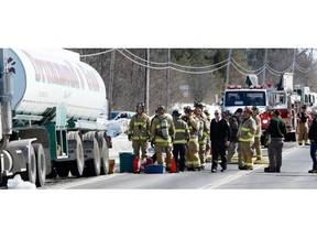 Ottawa firefighters scrambled Friday afternoon to contain a large leak of gasoline from a tanker truck on River Road.