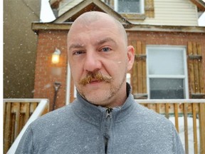 OTTAWA, ON, MARCH 12, 2014: Johnny Scratch is 39 years old. He was attacked at 1:30 a.m. on Wednesday, March 12 by would-be carjackers in the driveway of his home on Raymond Street near Lebreton. He managed to fight off the three attackers, save his car, and remain unharmed. He is pictured in front of his Raymond Street home, which was the scene of the attack. (Megan DeLaire/Ottawa Citizen), for 0313-city-brf-carjacking  ORG XMIT: POS1403121655019360