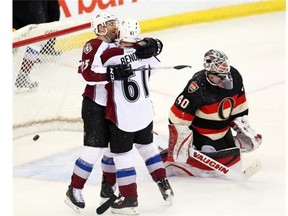 Ottawa Senator goaltender Robin Lehner(40) looks on as Colorado Avalanche's Andre Benoit (61) celebrates his goal with teammate Maxime Talbot (25) during second period NHL action in Ottawa, Sunday March 16, 2014. THE CANADIAN PRESS/Fred Chartrand