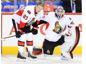 The Ottawa Senators’ Ales Hemsky, left, and Robin Lehner take part in team warm-up prior to their NHL game agains the Calgary Flames at the Scotiabank Saddledome in Calgary, Alberta Monday, March 3, 2014.