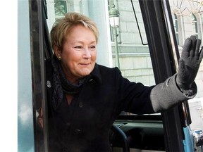 Parti Quebecois leader Pauline Marois waves from her campaign bus as she hits the campaign trail Wednesday, March 5, 2014 in Quebec City, Que.. Quebecers will vote in a provincial election April 7, 2014.THE CANADIAN PRESS/Ryan Remiorz
