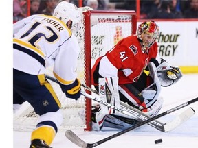Craig Anderson of the Ottawa Senators makes the save on Mike Fisher of the Nashville Predators during second period of NHL action at Canadian Tire Centre, March 10, 2014.