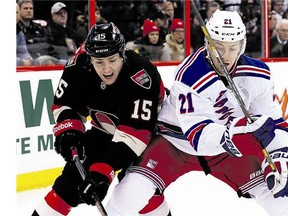 Senators forward Zack Smith and the Rangers' Derek Stepan battle for the puck along the boards during the Rangers' 4-1 victory in Ottawa on Jan. 18. New York is back at the Canadian Tire Centre on Tuesday.