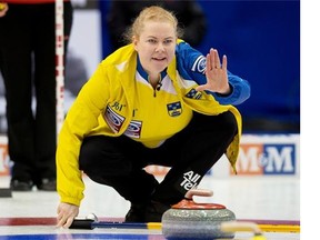Swedish skip Margaretha Sigfridsson directs her sweepers as they play Denmark in a women’s world curling championship game on Tuesday at Saint John, N.B. The Swedes won 7-2.