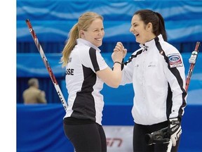 Switzerland skip Binia Feltscher embraces Irene Schori, left, in celebration after their team defeated South Korea 7-3 in semi-final action action of the women’s world curling championship at Saint John, N.B., on Saturday.